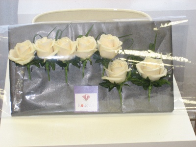 Buttonholes in white avalanche roses